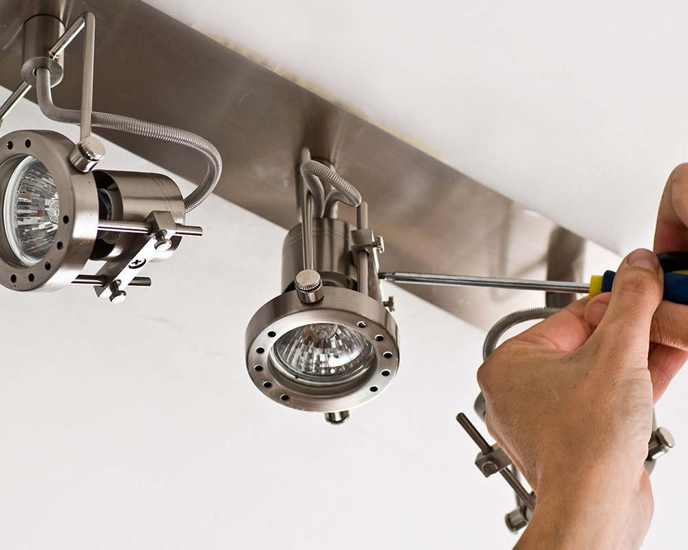 electrician installing lights on ceiling austin tx